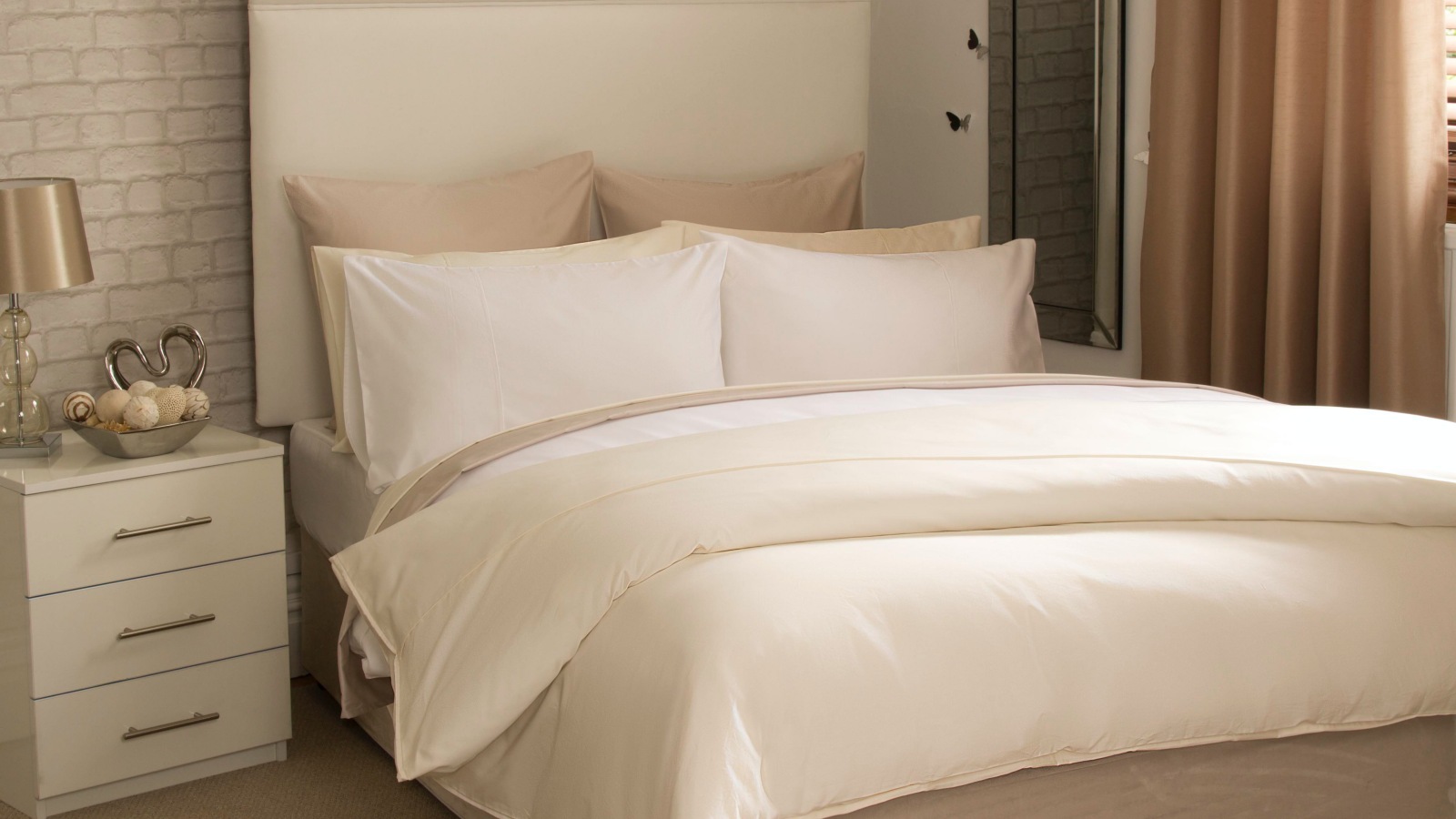 450 thread Count Pima Cotton, Oyster Bed sheets draped over bedframe.